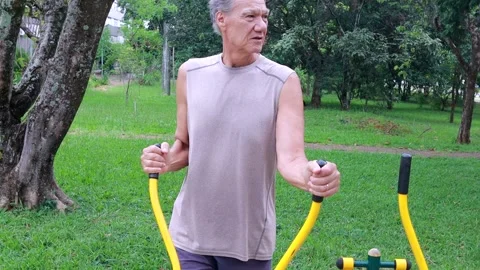 Slow Motion of an Older Man working out at an Outdoor Gym Video stock 327227770