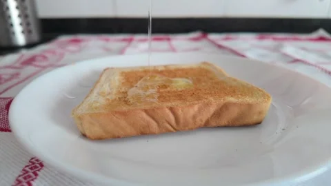 Slow Motion Olive Oil Pouring Over Toasted Bread in 4K Stock Footage 341396509