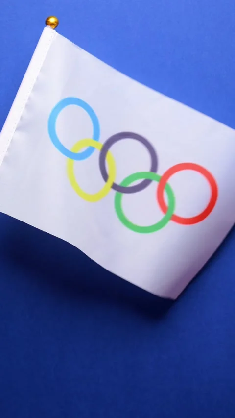 Slow motion of Olympic Games flag in the wind at vertical composition Stock Footage 280518364