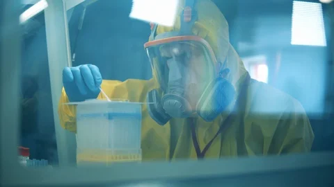 Slow motion. One man develops a vaccine for coronavirus while working in Video stock 129050379