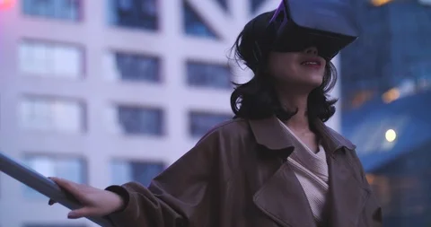 Slow motion of one pretty young asian woman with VR ,virtual reality headset Stock Footage