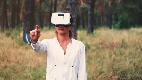 Slow motion of one pretty young woman with VR ,virtual reality headset outdoor Stock Footage 248884747