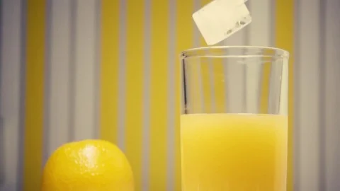 Slow motion orange juice with ice cubes Stock Footage 72117194
