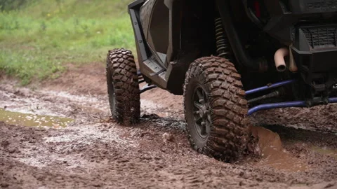 Slow Motion of ORV Tires Rolling Through Mud Stock Footage 243205372