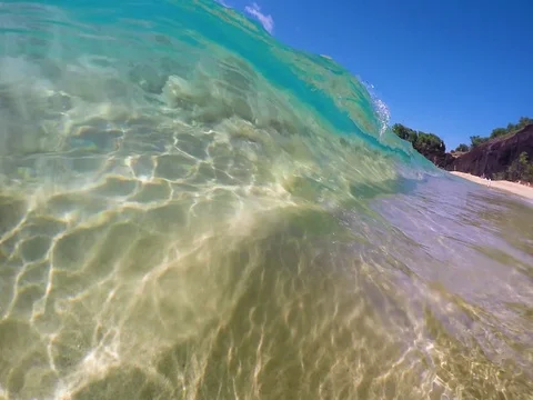 Slow Motion Over and Under Water View Of A Barreling Clear Ocean Wave Video stock 83963562