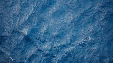 Slow motion over disturbed ocean water surface, loopable. Impressive background  Stock Footage 150746644