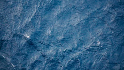 Slow motion over disturbed ocean water surface, loopable. Impressive background  Stock Footage 150746673