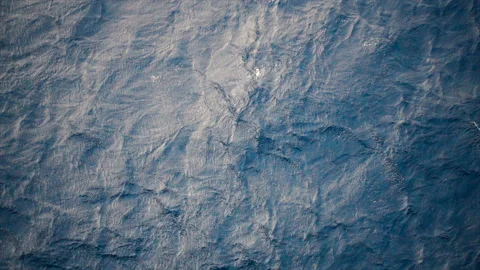 Slow motion over disturbed ocean water surface, loopable. Impressive background  Stock Footage 153892315
