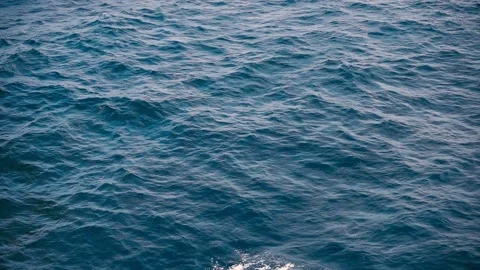 Slow motion over disturbed ocean water surface, loopable. Impressive background  Stock Footage 203710596
