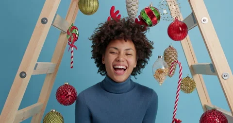 Slow motion of overjoyed dark skinned woman laughs happily hears funny anecdote Stock Footage 144060236