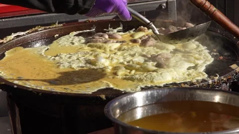 Slow motion of oyster omelet spread on griddle at Taichung night market Stock Footage 311817140