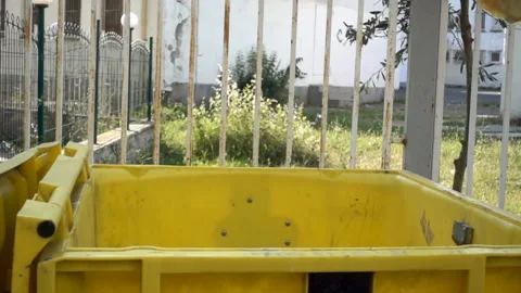 Slow motion a package of trash flies and falls in the trash can. Stock Footage 113354654