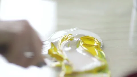 Slow motion paint mix with chisel Stock Footage 160518291