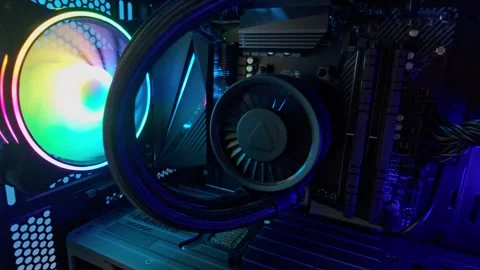Slow motion pan across gaming pc interior with rgb lighting, liquid cooling.. Stock Footage 328572341