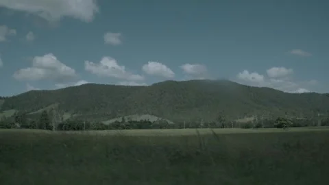 Slow Motion Pan Across Green Hills and Fields in Sunshine Coast Hinterland Austr Stock Footage 341297768