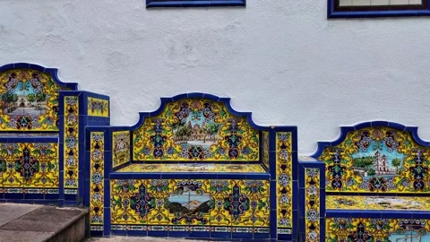 Slow motion pan of ornate azulejo tile benches, Firgas, Gran Canaria Stock Footage 346538131