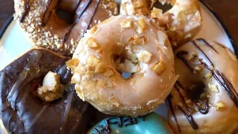 Slow motion pan over delicious glazed donuts, HD 스톡 동영상 101649126