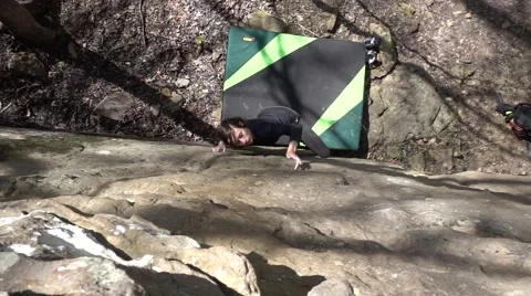 Slow Motion Pan Reveals Cute Young Climber Girl From Mossy Rocks Video stock 62276423