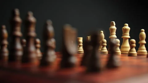 Slow Motion Pan Shot of Closeup Chess Board and Pieces Stock Footage 236946297