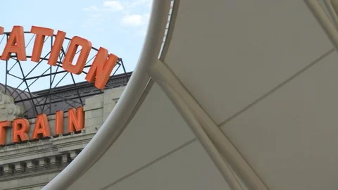 Slow Motion Pan To Train Station Sign 스톡 동영상 105247456