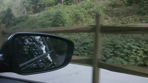 Slow motion pan while driving to rope mill park following the wooden fencing Video stock 145682377