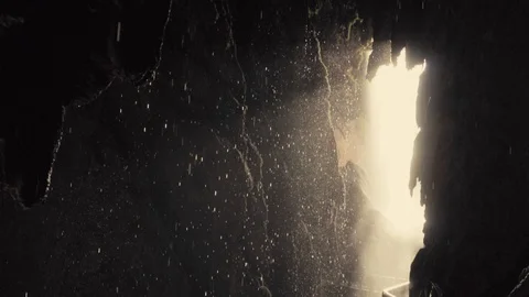 Slow motion panning shot of interior of tropical cave with drops falling. Stock Footage 114273628