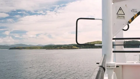 Slow motion panning shot over Scottish Islands from a ferry in Mull, Scotland Stock Footage 138407239