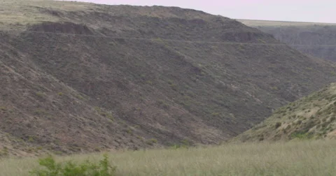 Slow Motion Panning Shot of a Valley from a Peak Stock Footage 61717602