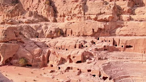 Slow motion panning view cave houses in Petra site with theater monument Stock-Footage 227430259