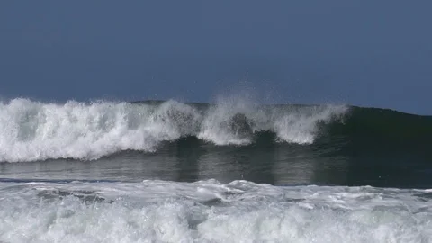 Slow motion panning view of wave breaking at Playa Grande Costa Rica Stock Footage 91012242