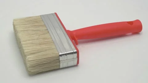 Slow motion panorama of a ceiling brush on a white background. Stock Footage 267534984