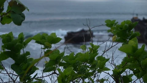 Slow Motion Panorama of Ocean Wave Crashing About Rock Bali Stock Footage 104536368