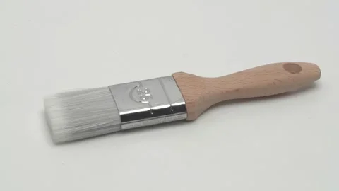 Slow motion panorama of a paint brush on a white background. Stockbeeldmateriaal 267543490