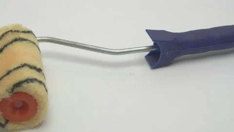 Slow motion panorama of a paint roller on a white background. Видео 267538467