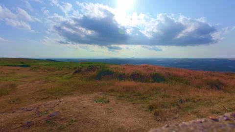 Slow motion panoramic view from hill summit with cloudy sky Stock Footage 340441769
