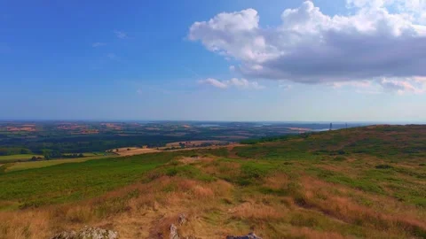 Slow motion panoramic view over green fields from high hill lookout Stock Footage 340441455