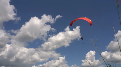 Slow Motion. Paragliding on the Background of Beautiful Clouds. Stock-Footage 64736359