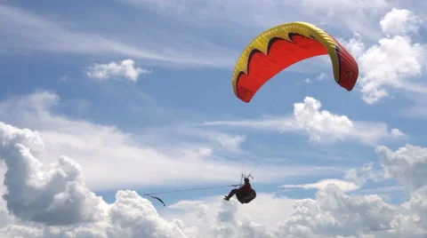 Slow Motion. Paragliding on the Background of the Sun and Beautiful Clouds. Video stock 64746638