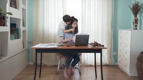 SLOW MOTION Parent working from home. Remote work. Family on self-isolation. Stock Footage 129381989