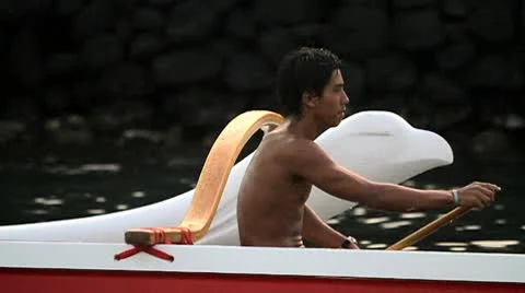 Slow motion pass of an outrigger canoe rowed by a native Hawaiian. Stock Footage 9228442