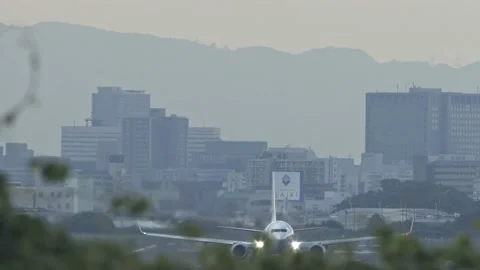 Slow motion of passenger jet taking off just before dusk. Stock Footage 138341128