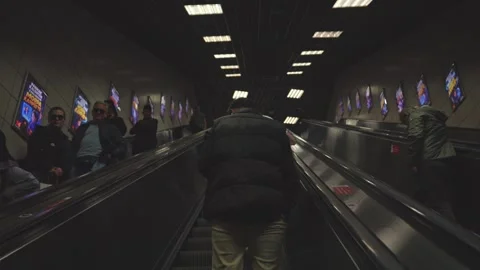 Slow Motion Passengers Passing on Opposite Metro Escalators Underground Stock Footage 347068301