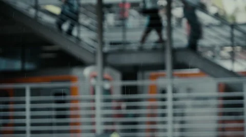 Slow motion passengers on train station,rainy day train passing by Stock Footage 55740116