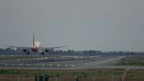 Slow motion of the passsenger airplane touching down the runway in Barcelona 스톡 동영상 230290243