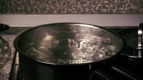 Slow motion pasta are falling into the pot Stock Footage 71976387