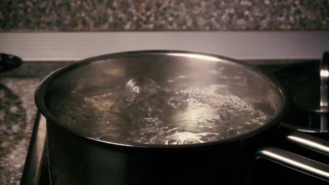 Slow motion pasta are falling into water Stock Footage 71976526