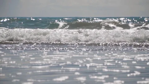 Slow Motion of Peaceful Waves from Ocean Shore Stock Footage 90971210