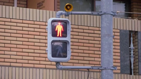 Slow motion of pedestrian lights changing on modern building with soft daylight Stock Footage 322118617