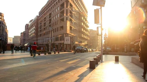 Slow Motion. Pedestrians walking on the background golden sunset in the city Stock Footage 83578204