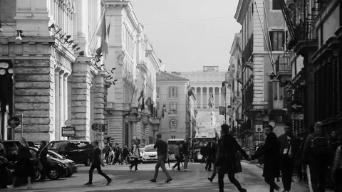 Slow Motion Pedestrians Walking in Central Rome Italy Black and White Stock Footage 345148799